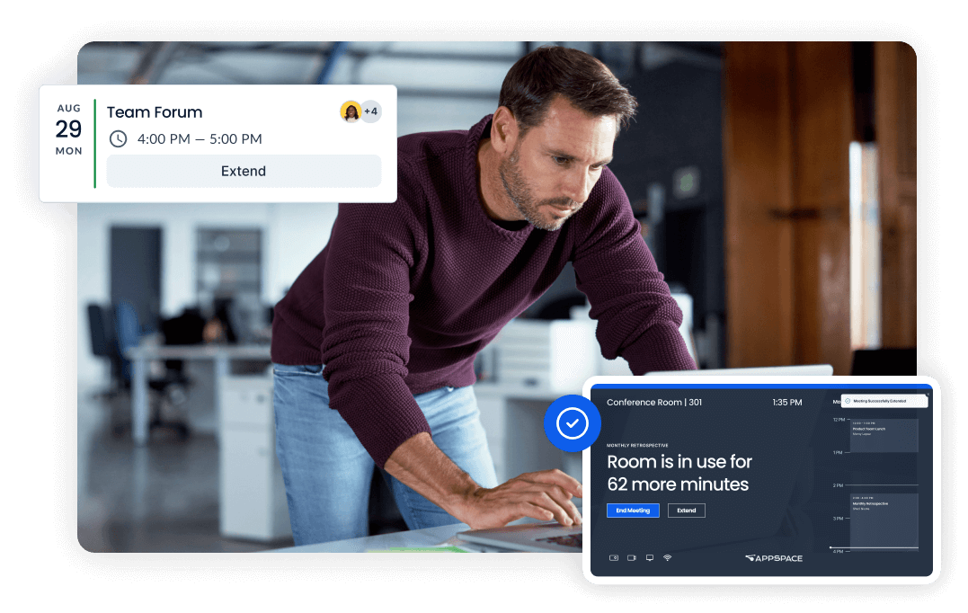 A man wearing a maroon sweater leans over a table, looking at a tablet displaying a message that a conference room is in use for 62 more minutes. Above him is a digital calendar showing a meeting scheduled for August 29, Monday.